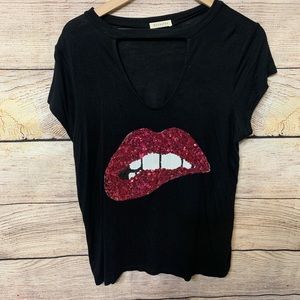 Graphic tee / lip bite / low cut v neck with strap
